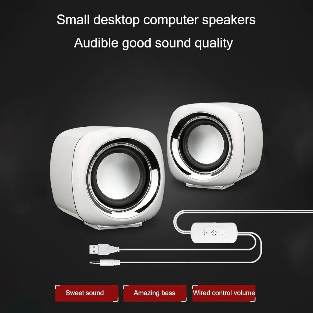 Black and white mini computer speakers with wired 3.5mm connection for desktop audio enhancement