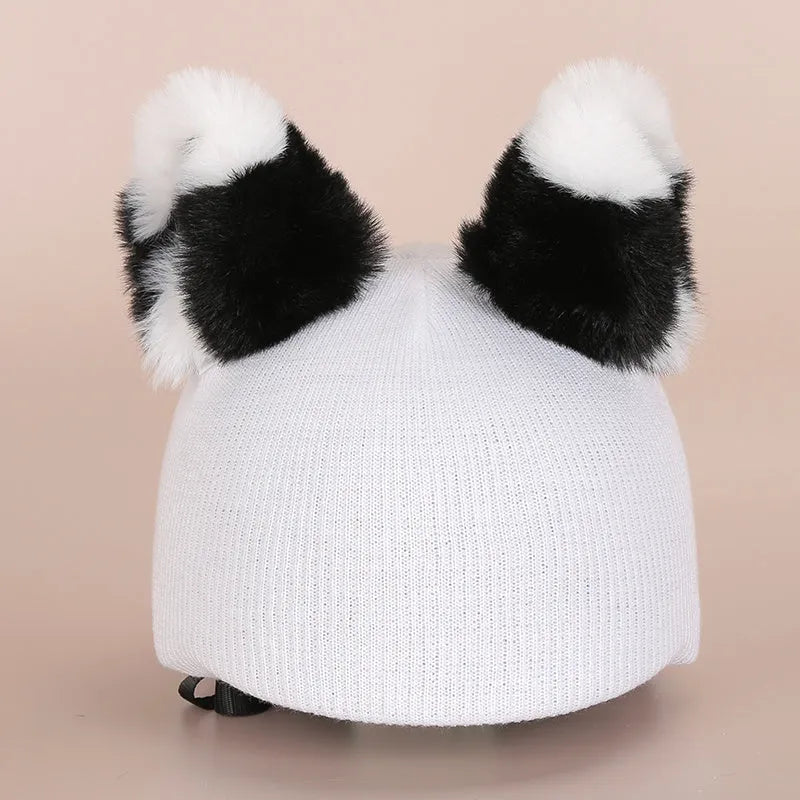 A soft plush cartoon hat decoration designed to cover a ski helmet, shown in one of 32 available colour styles.
