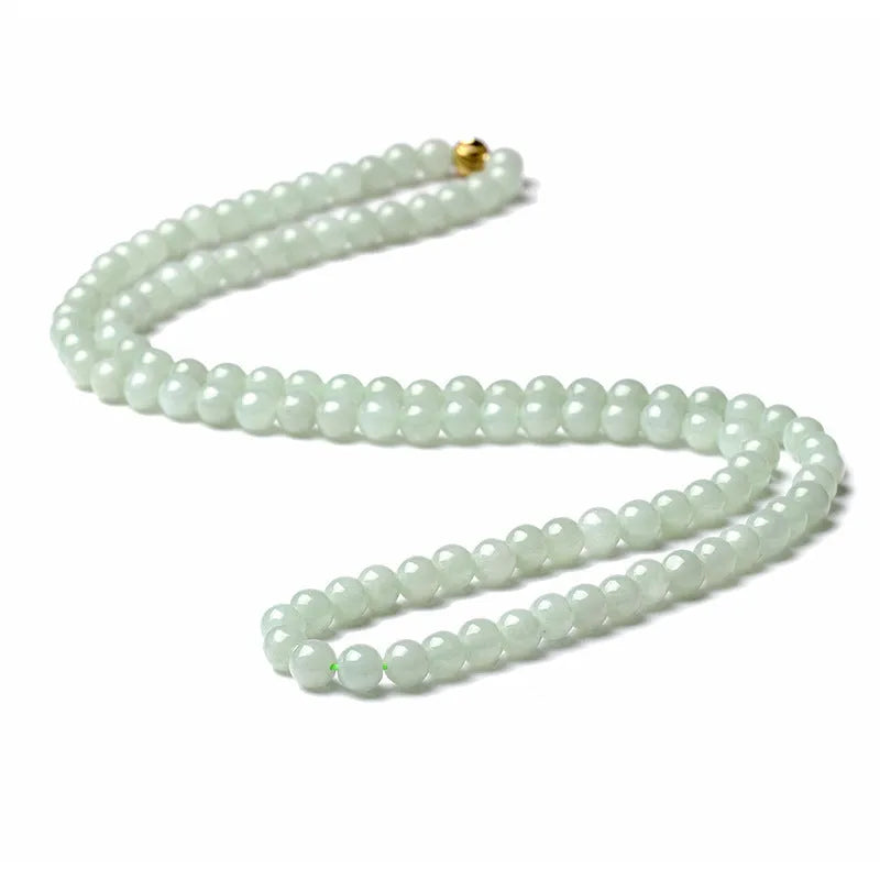 Women's adjustable jade bead necklace with round white green beads on a chain.