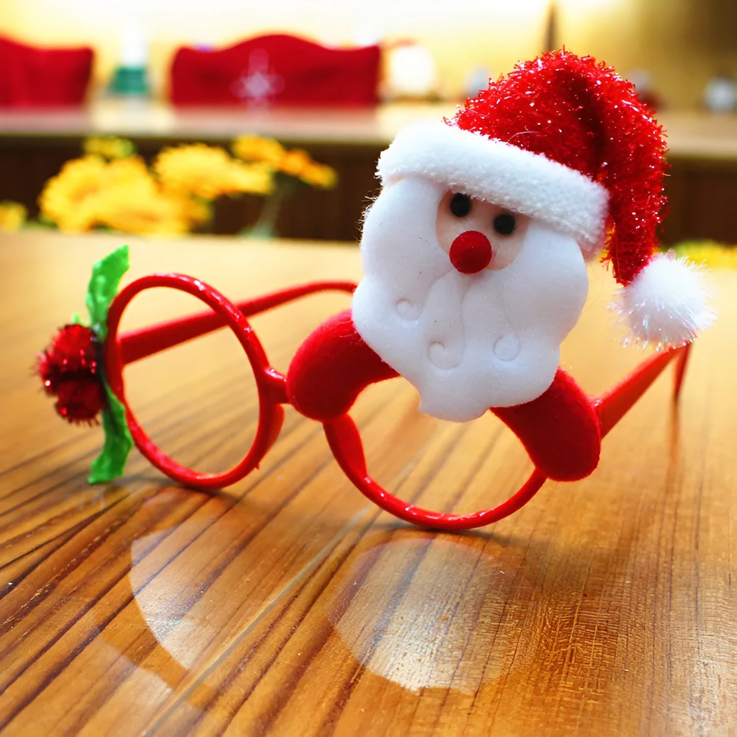 Set of four Christmas novelty glasses: Santa, Snowman, antlers, and rabbit ears designs.
