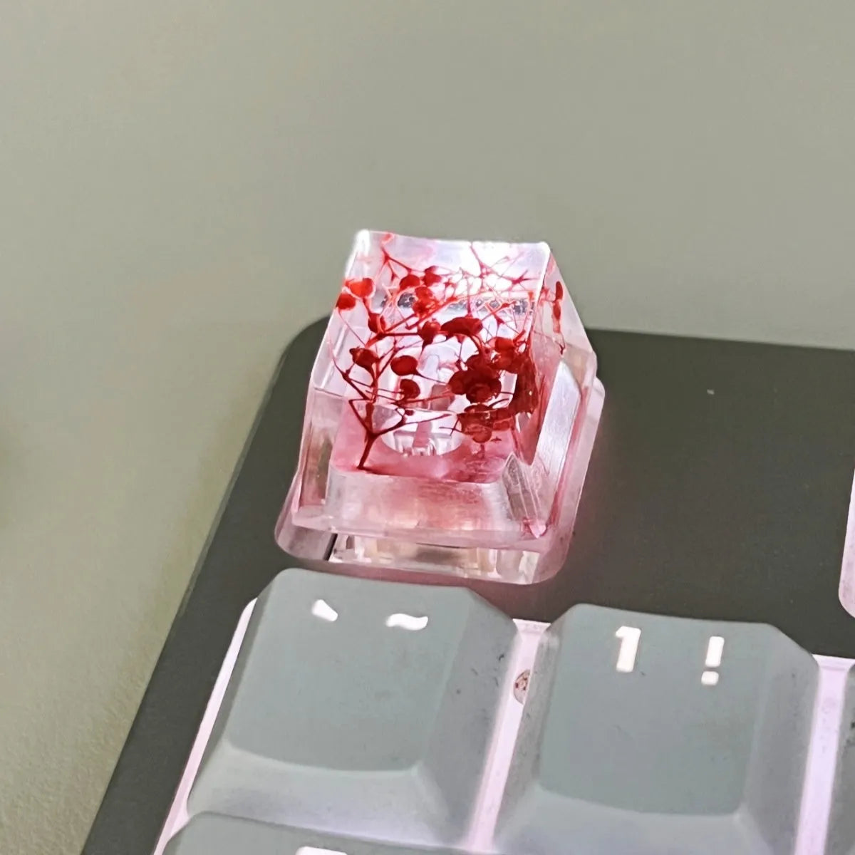Transparent resin keycap with glitter particles creating starry night effect for mechanical keyboards