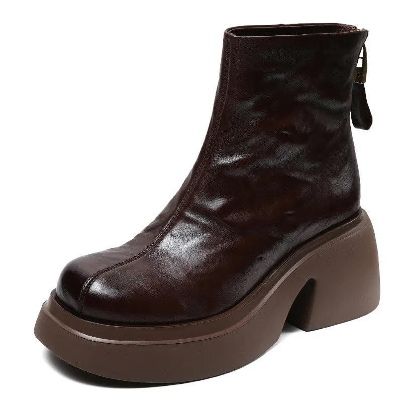 Women's chunky heel ankle boots in black with thick bottom, rubber outsole, and cotton cowhide upper