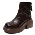 Women's chunky heel ankle boots in black with thick bottom, rubber outsole, and cotton cowhide upper
