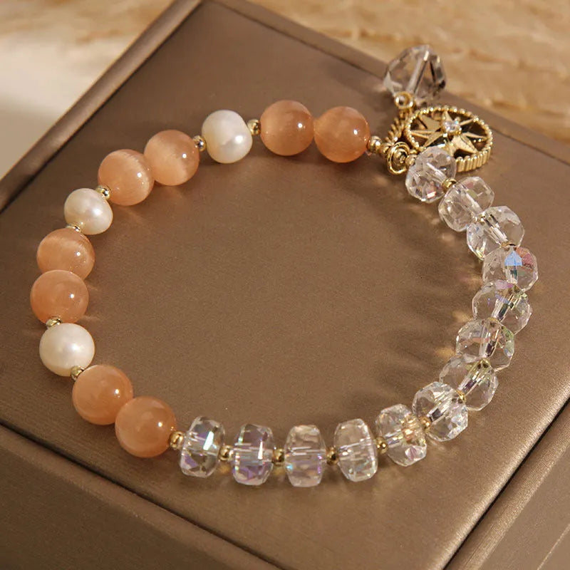 Gold-plated bracelet with eight Awn star motif and orange opal crystals