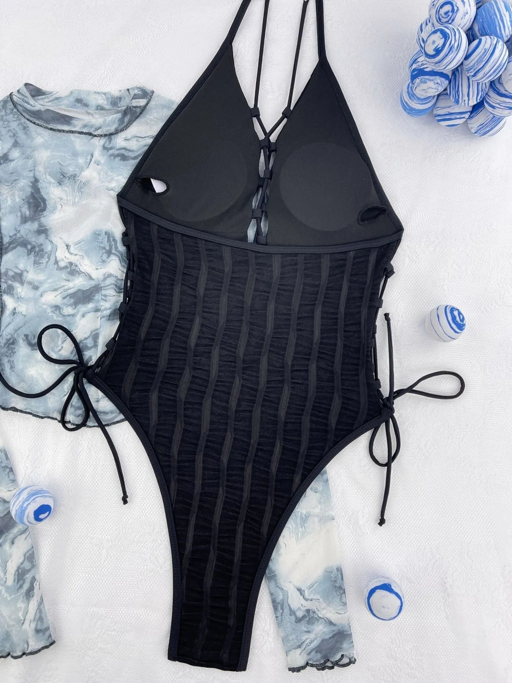 Black solid colour one-piece swimsuit for women shown flat