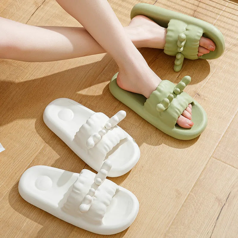 Deer horn patterned EVA flip flops for couples on a white background.