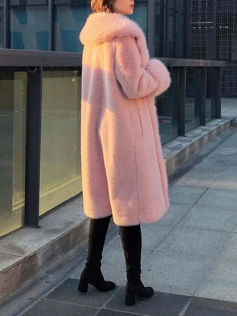 A grey women's mid-length leather coat with thick faux rabbit fur trim and collar.