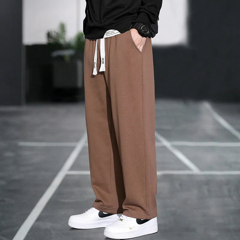 Men's grey casual bamboo fibre trousers with a high waist and multiple pockets.