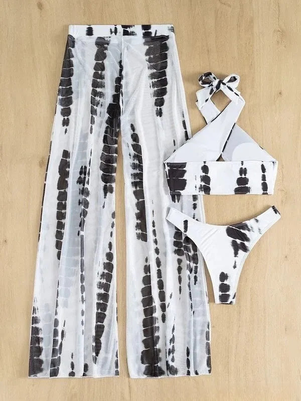 Women's black and blue printed three-piece swimsuit set with mesh trousers.