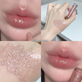 Moisturising flash lip gloss with mirror finish in five colours: cherry blossom pink, gilded flash, peach, purple, and berry red.