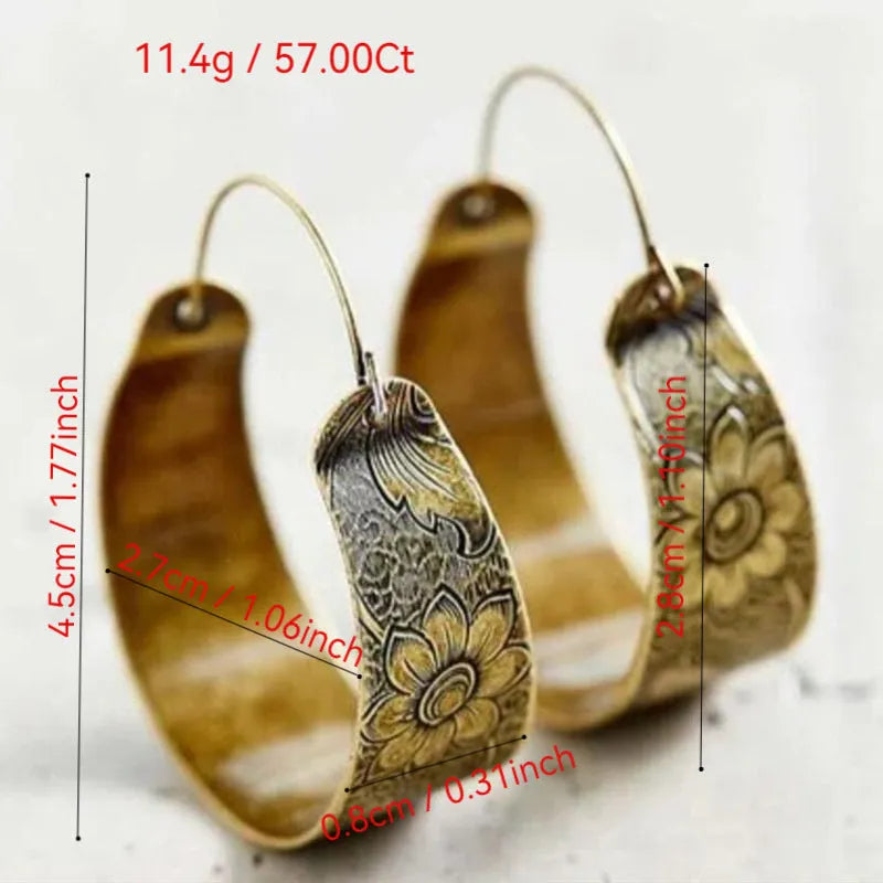 Gold geometric hollow pattern lady's earrings with petal design in Maillard style