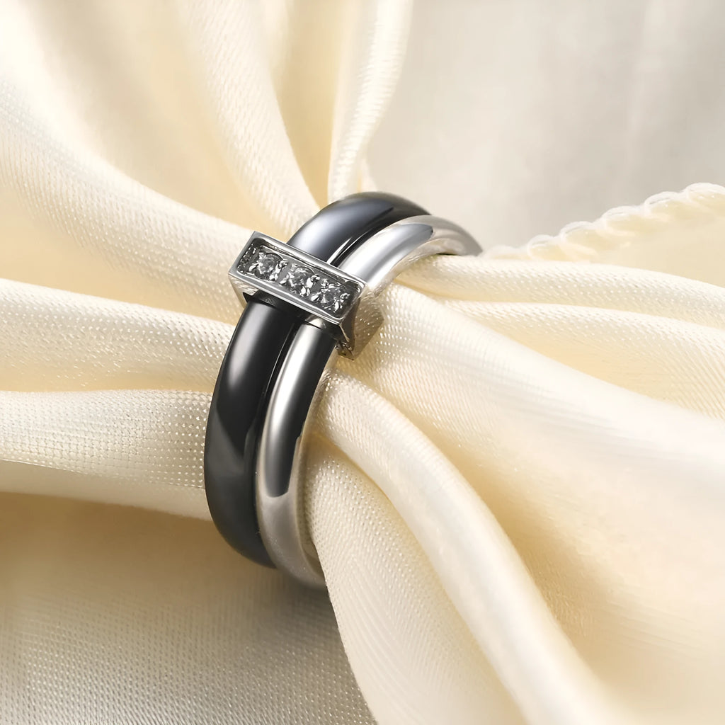 Geometric ceramic women's ring with glossy stitching and zirconium accents in steel black.