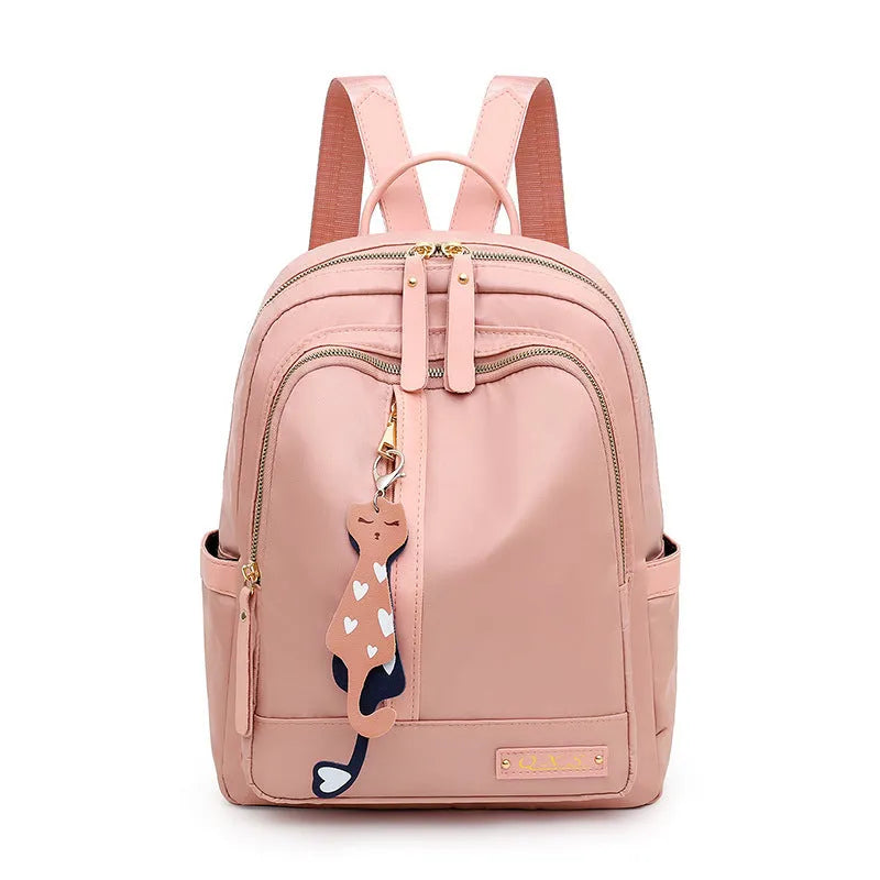 Black nylon women's casual backpack with internal pockets and double shoulder straps.