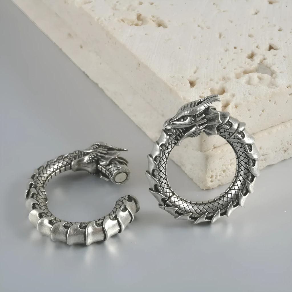 Large geometric dragon-shaped earrings in antique silver stainless steel alloy.