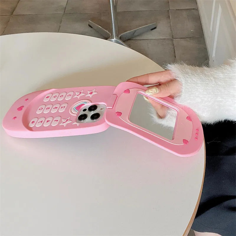 Light pink silicone flip phone case with mirror for iPhone, showing cute cartoon design.