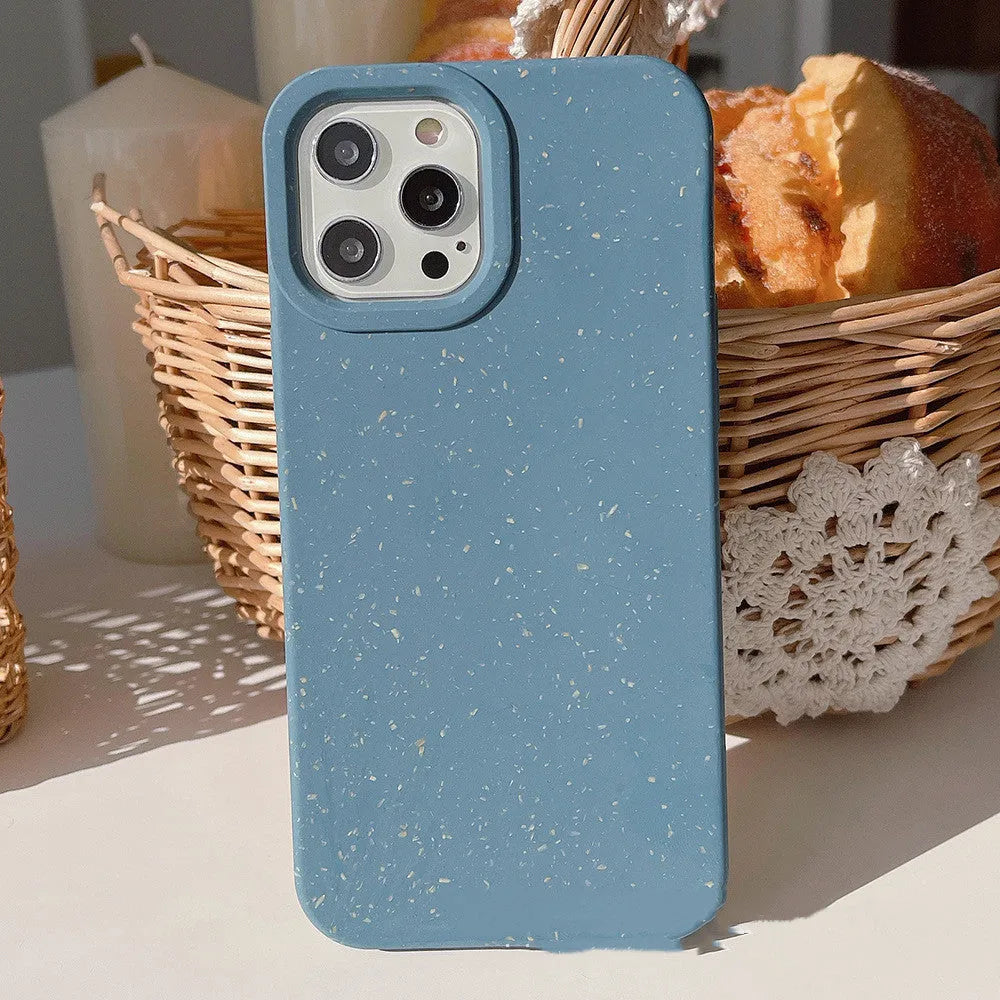 Wheat straw fibre degradable rear cover case for Apple iPhone on a table.