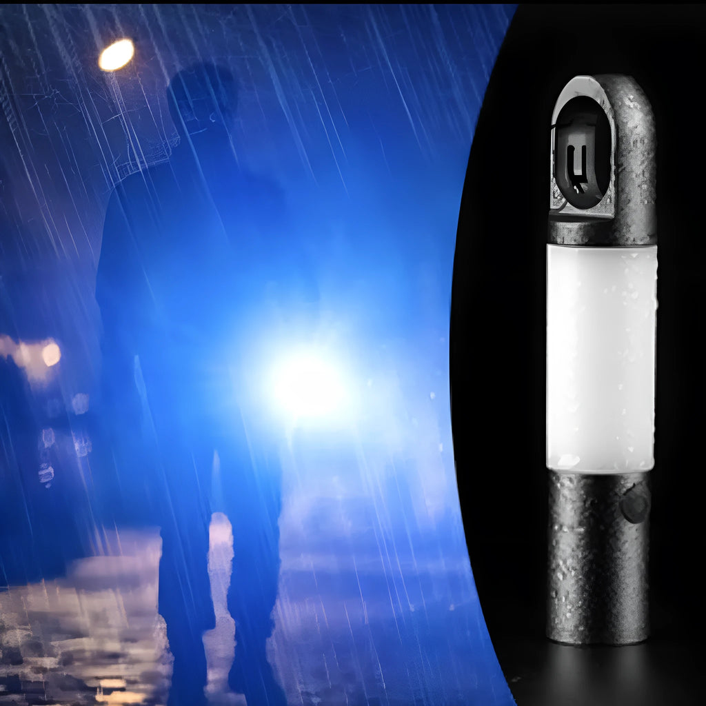 Silver aluminium alloy outdoor charging LED work light with magnetic top and hook, on a dark surface