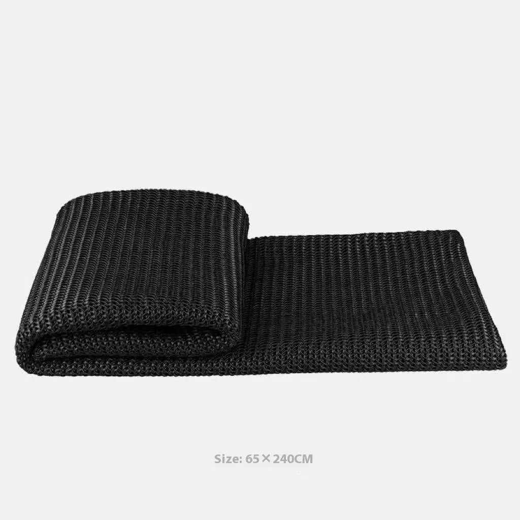 Modern minimalist grey and white plaid bed runner blanket set with pillow on a double bed.