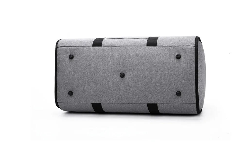 Medium cylinder travel bag in black showing zipper opening and cylindrical shape.