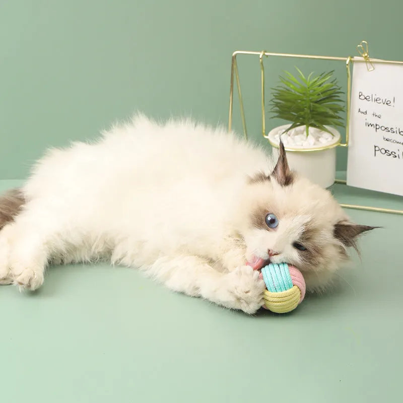 Handmade cotton cat hair ball plush toy in blue, green, and pink colour combinations, size 5 cm.