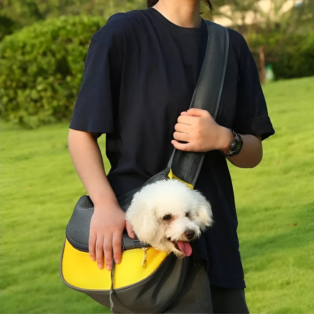 Mesh fabric pet carrier sling bag with single shoulder strap, shown in assorted colours.