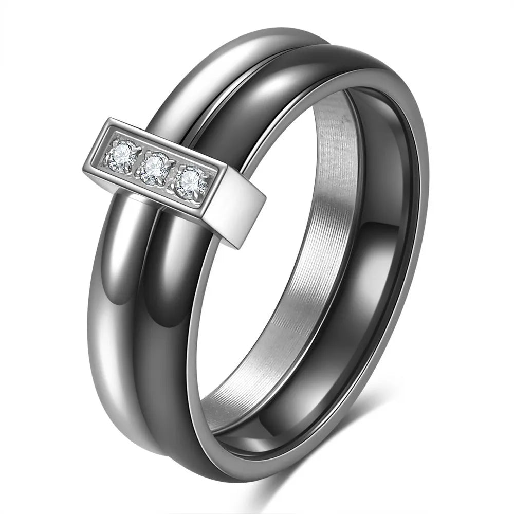 Geometric ceramic women's ring with glossy stitching and zirconium accents in steel black.