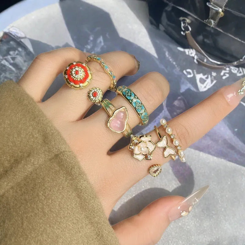 Adjustable copper ring with New Chinese style gourd, flower, and bow design in a vintage oil drip pattern.