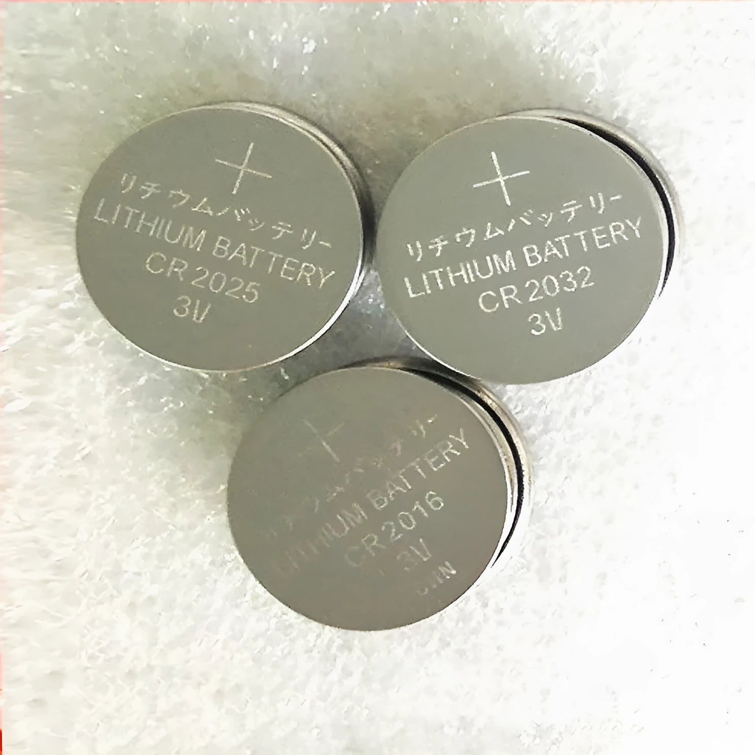 Pack of 3V alkaline button batteries showing CR2032, CR2025, and CR2016 models.