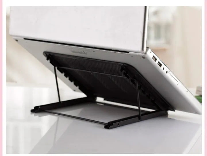 Folding aluminium laptop stand in silver colour, shown at an angle with a laptop on it