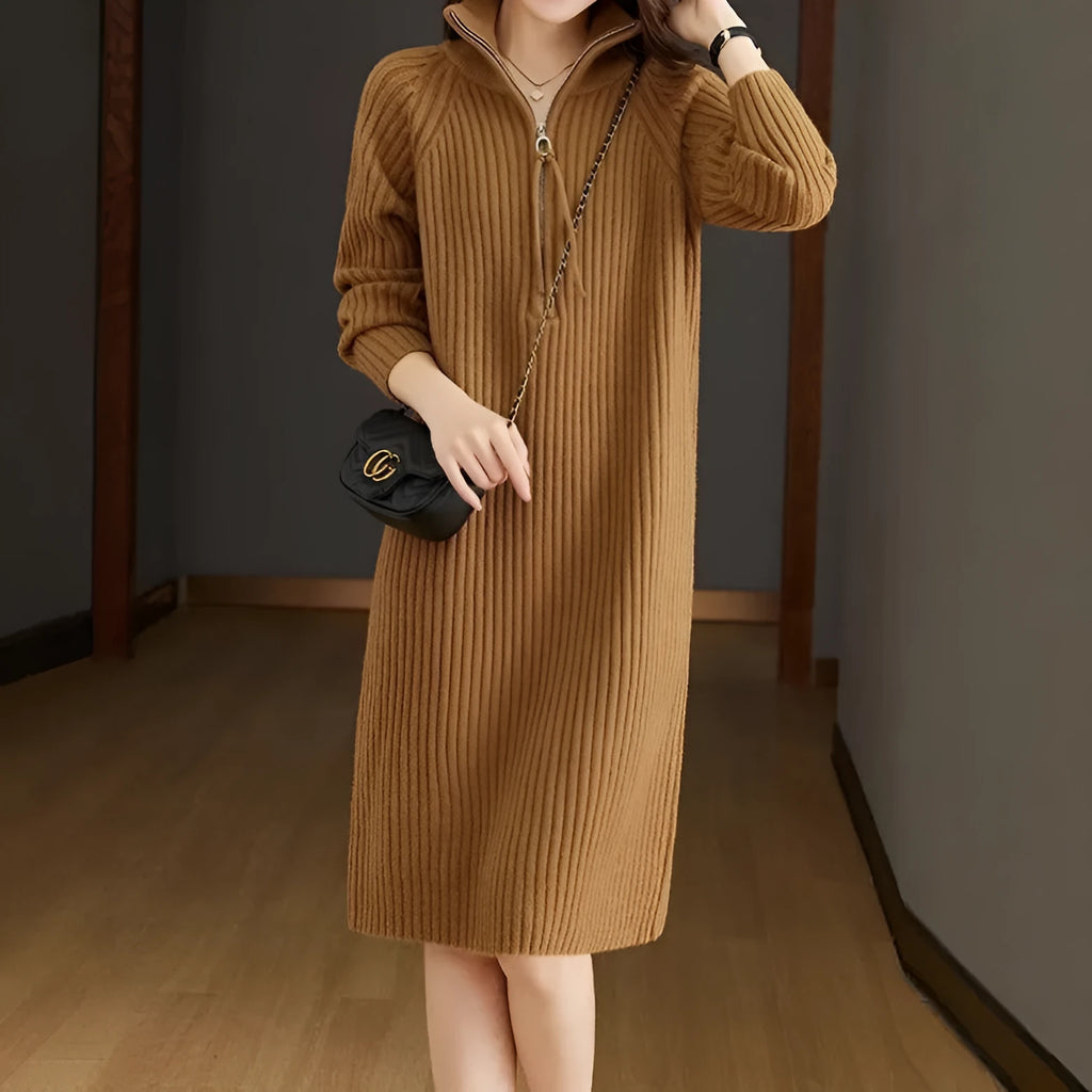 Beige casual women's skirt with half front zipper, stand collar, and long sleeves on a hanger.