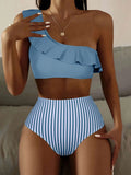 Women's striped and solid colour two-piece bikini swimsuit on a neutral background