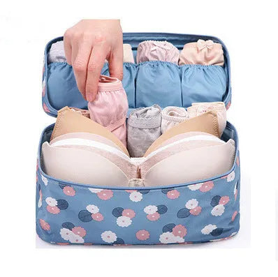 Travel underwear organizer 28x14x14.5cm in leopard print, showing multiple compartments and zipped closure.