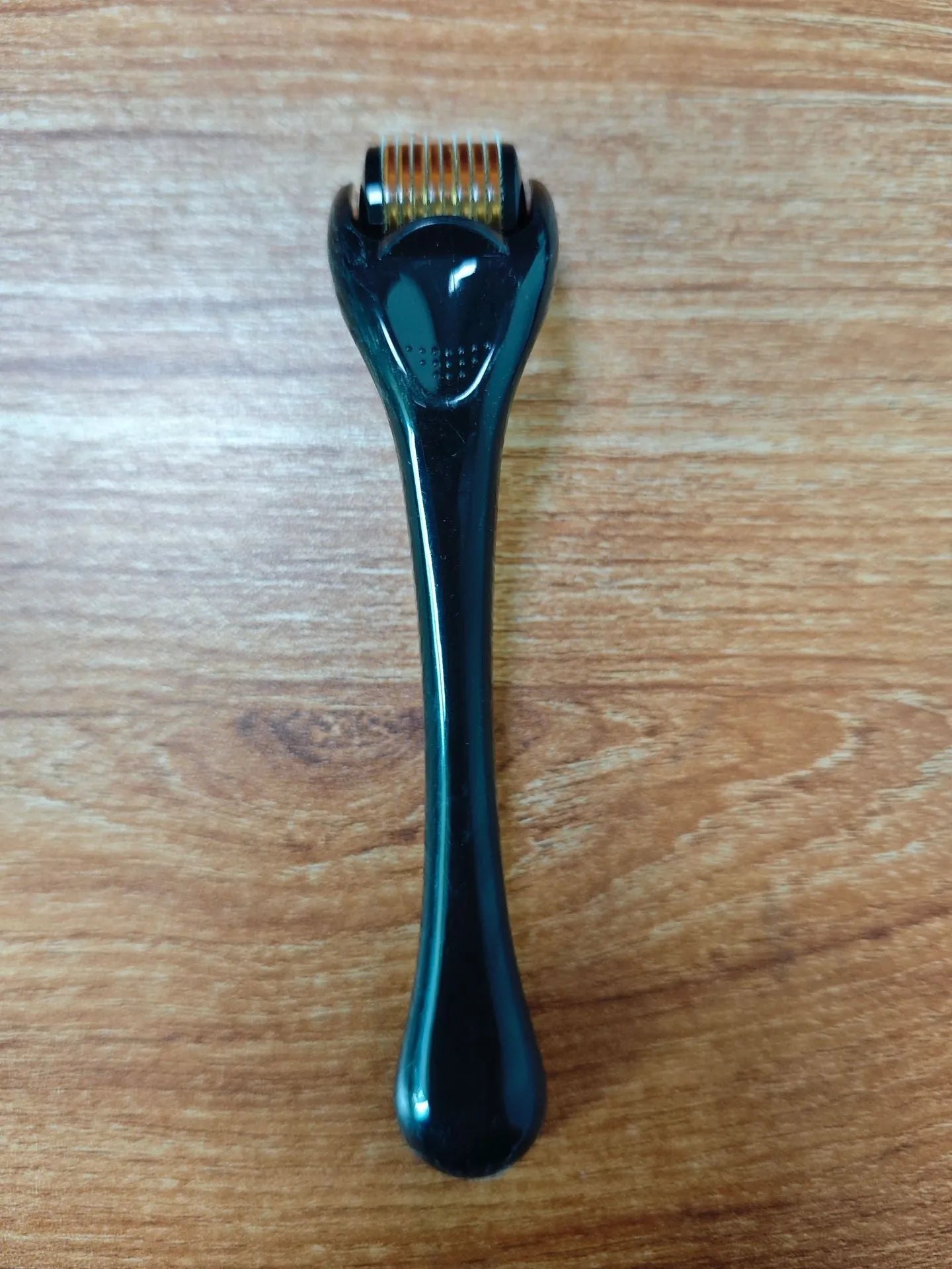 540 micro needle mechanical derma roller with black handle and coloured wheel options
