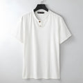 Women's loose fit linen-style V-neck short sleeve top in apricot colour on a hanger.
