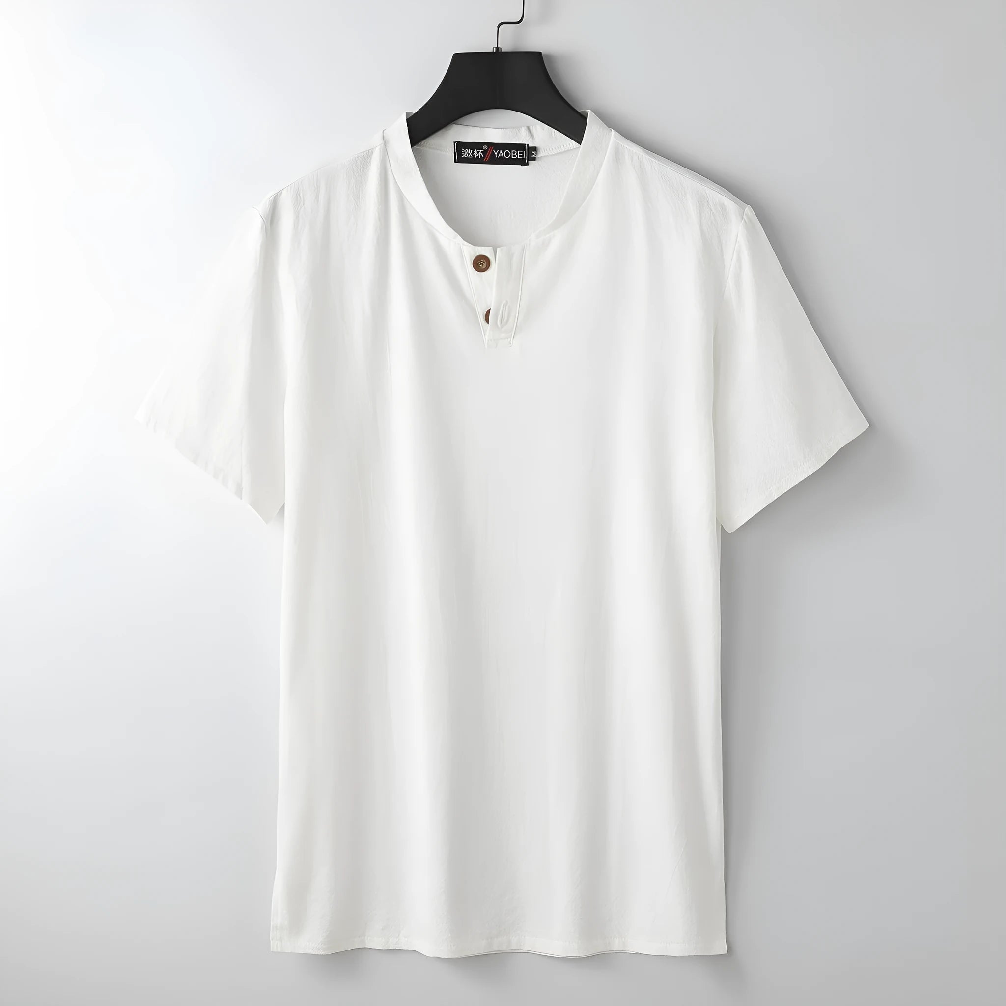 Women's loose fit linen-style V-neck short sleeve top in apricot colour on a hanger.