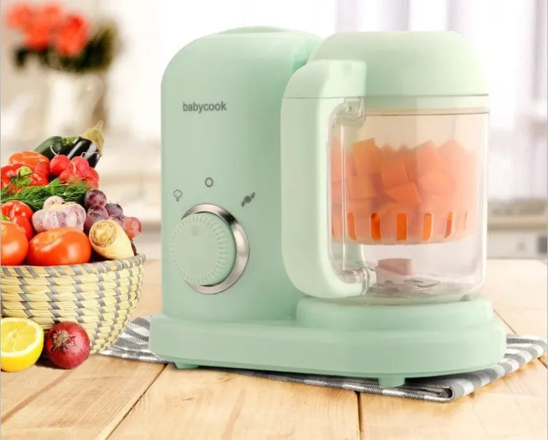 Baby food processor with steamer and blender functions in green or pink