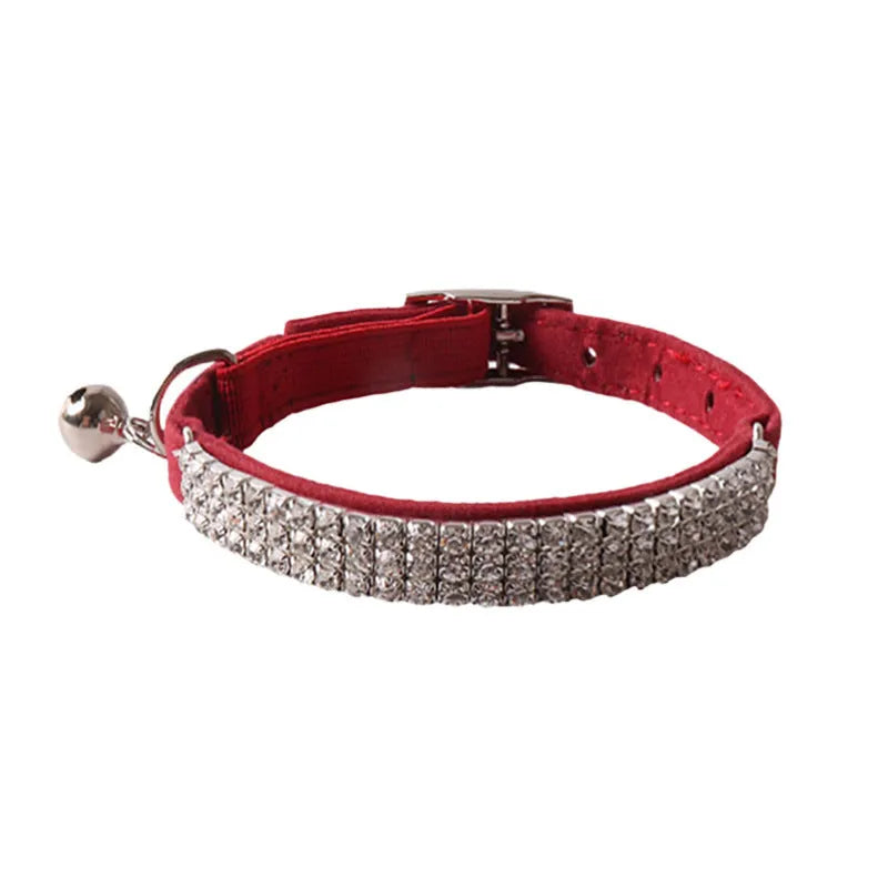 Colourful flocking cat collar with elastic buckle and gang drill pattern in pink, black, red, blue, purple, and dark brown.