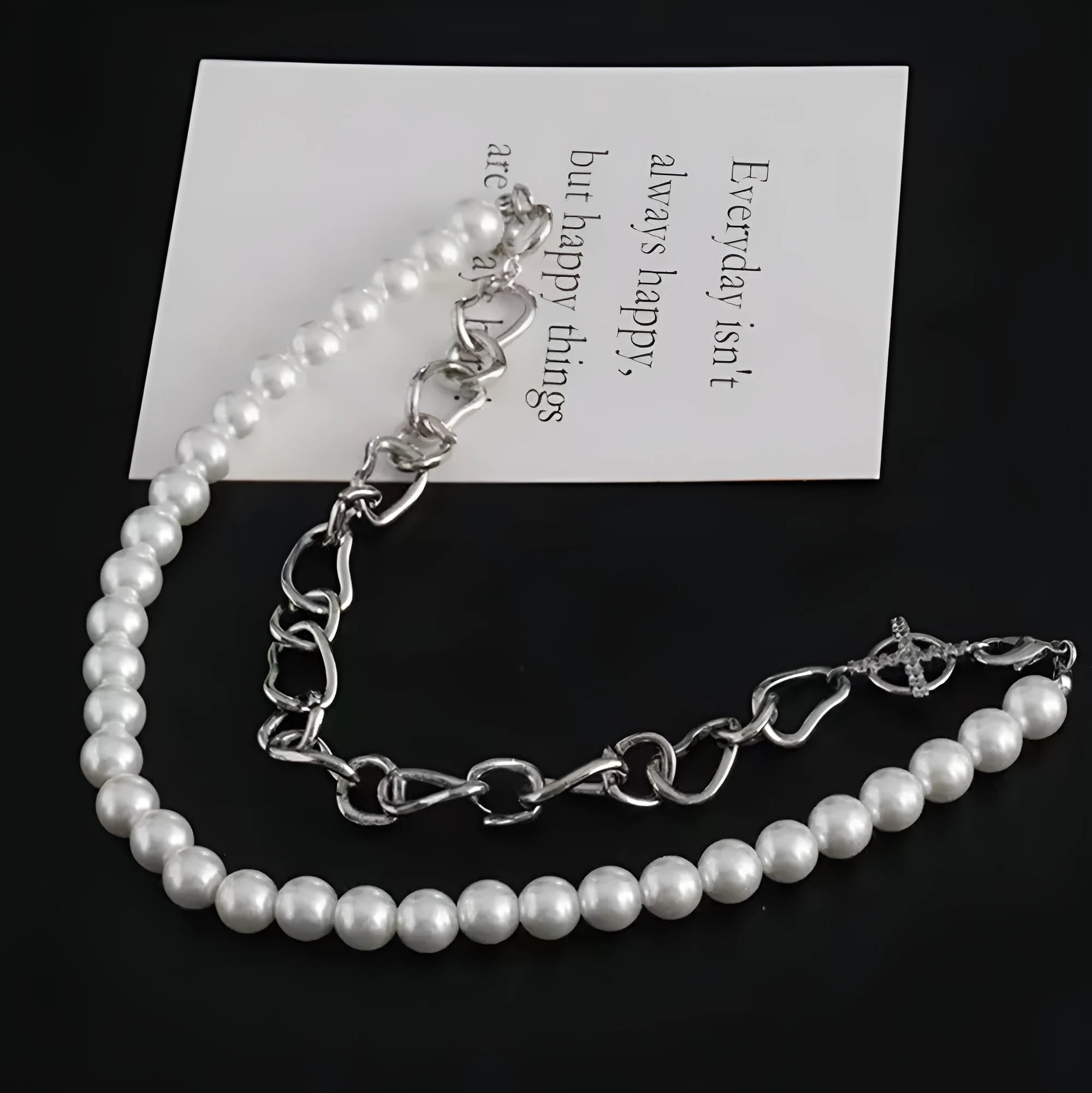 White acrylic geometric asymmetric pendant on twisted chain clavicle necklace
