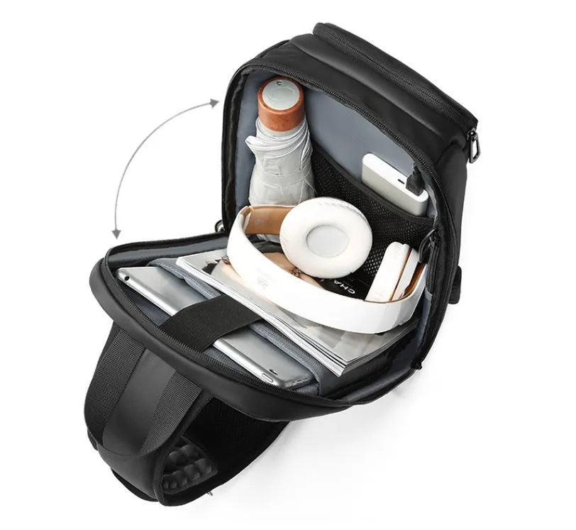 Black PVC outdoor shoulder bag showing internal laptop pocket and air cushion shoulder strap.