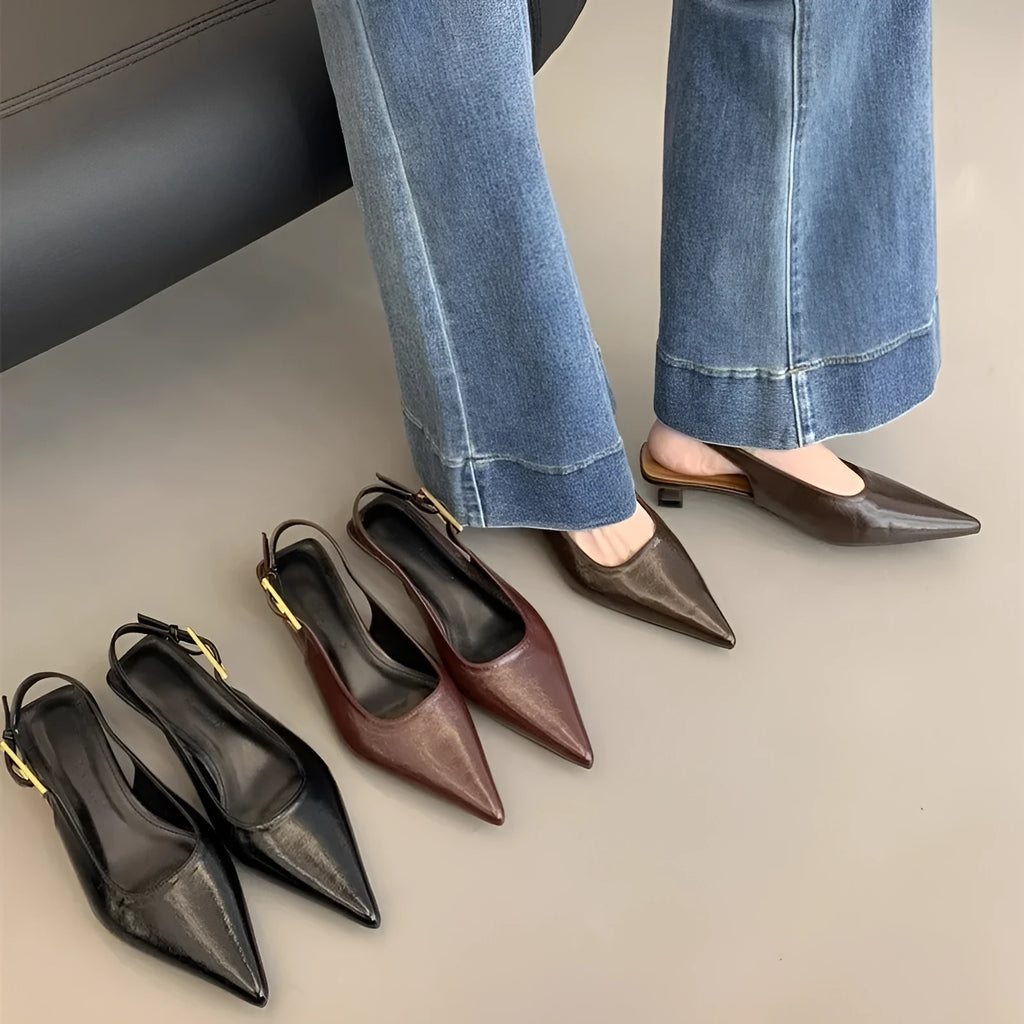Thin low heel strap pointed leather shoes in black, red, brown, and silver colour options showing rubber soles
