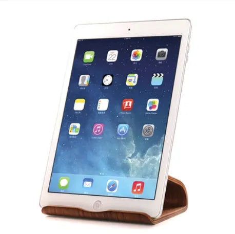 Bamboo wood tablet phone holder on desk with an Apple iPad propped up in landscape mode