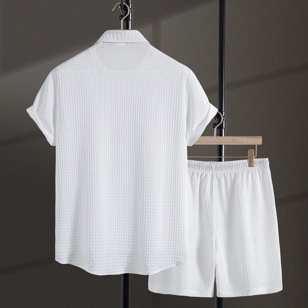 Men's white cotton blend short sleeve shirt and matching shorts beach suit laid flat.