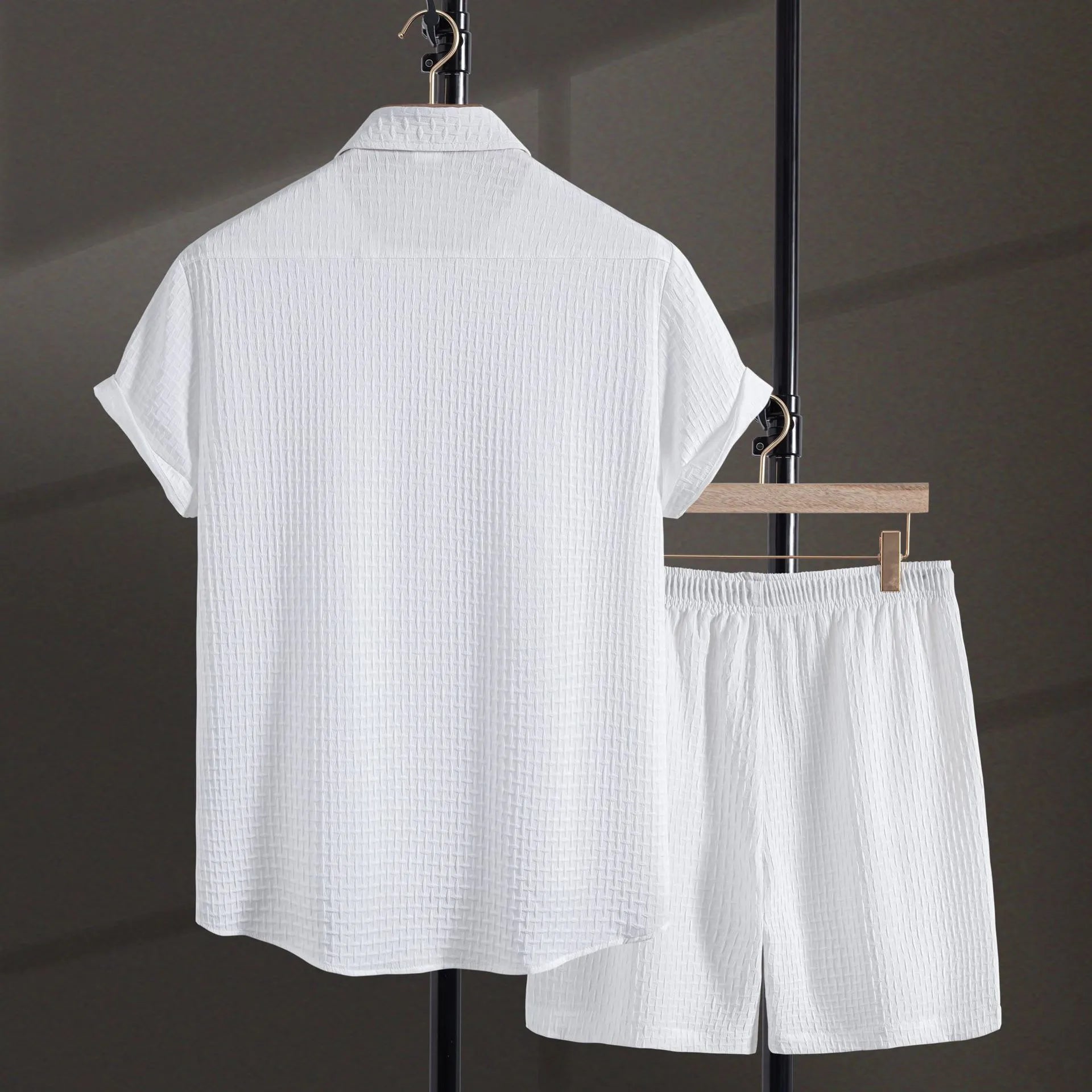 Men's white cotton blend short sleeve shirt and matching shorts beach suit laid flat.
