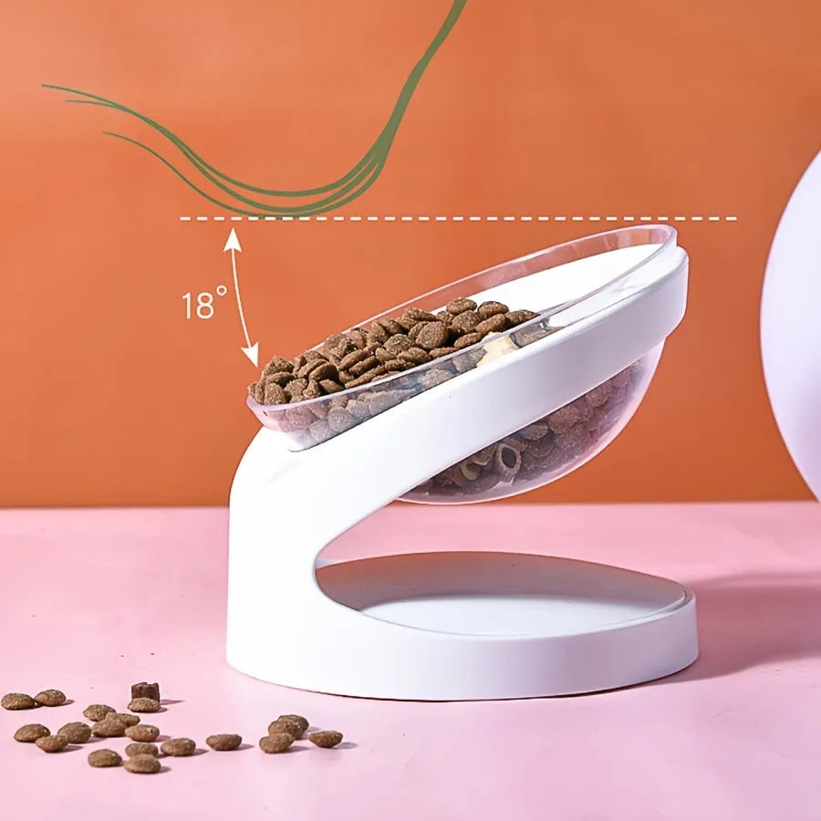 White elevated cat food bowl with a tilted surface on a raised platform.