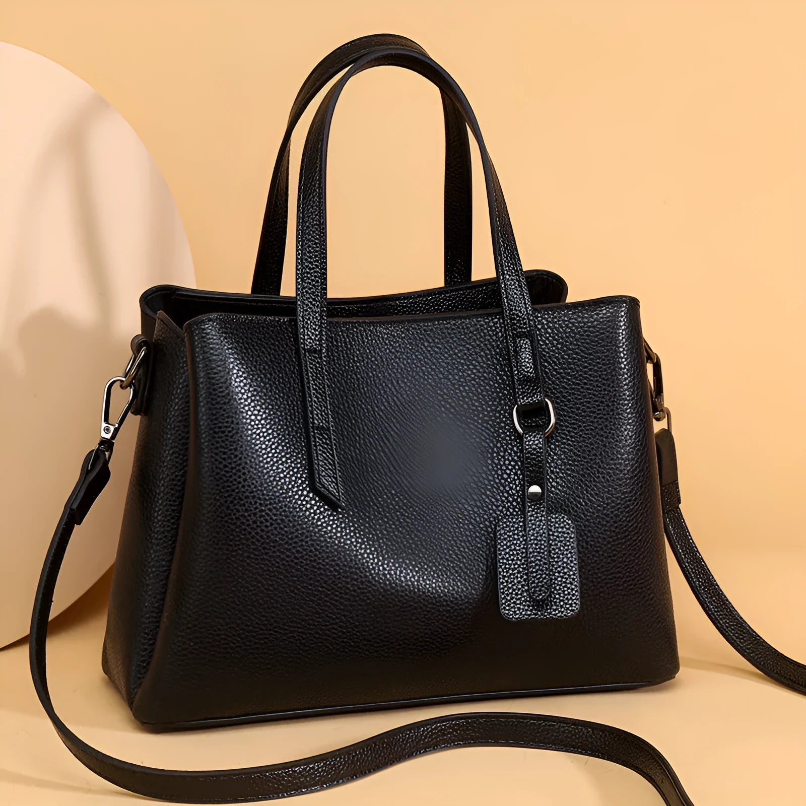 Women's cowhide leather shoulder handbag in horizontal square design with internal compartments