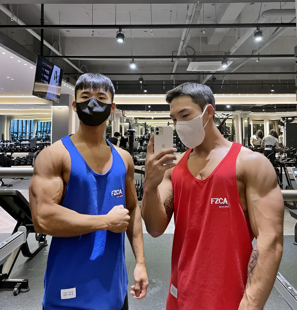 Men's white cotton fitness vest for summer running and gym training on a plain background
