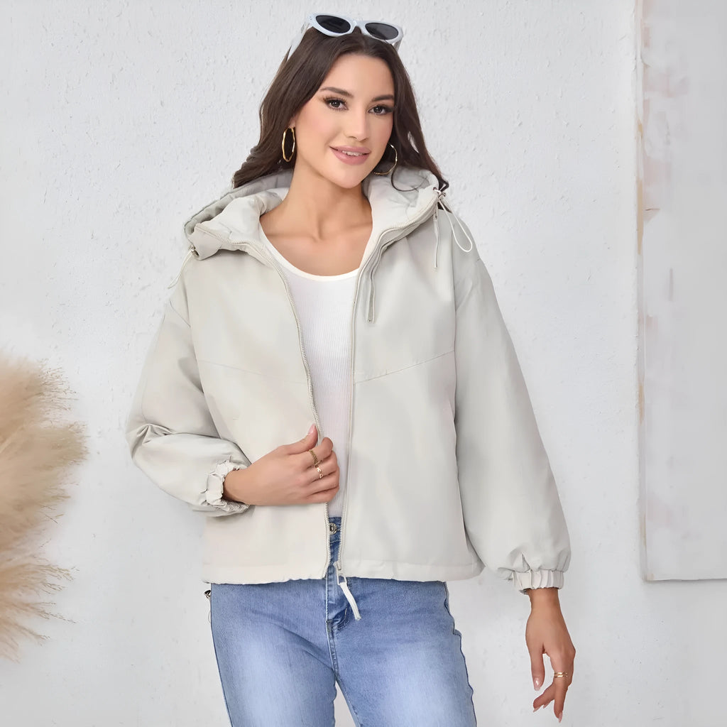 Women's hooded shell jacket in polyester available in grey, black, and purple with loose fit