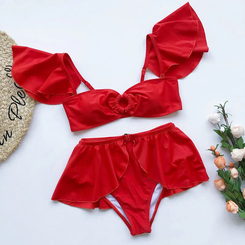 Women's red three-piece bikini swimsuit with flounced design detail