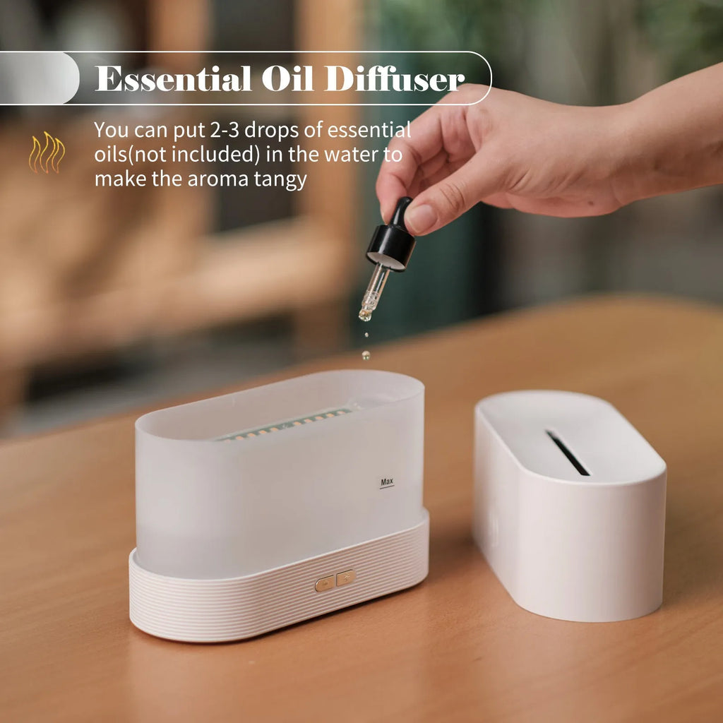 Black square ultrasonic aroma diffuser with LED flame light effect and mist output.