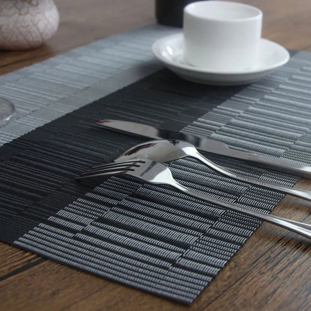 Modern non-slip PVC place mat on a dining table in gradient bamboo black colour.